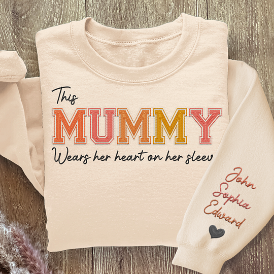 Wears Her Heart On Her Sleeve - Family Personalized Custom Unisex Embroidered Sweatshirt With Design On Sleeve - Gift For Mom, Grandma